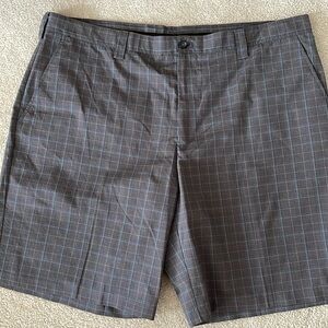 Men’s Izod golf shorts. Grey plaid with light blue stripe. New condition.